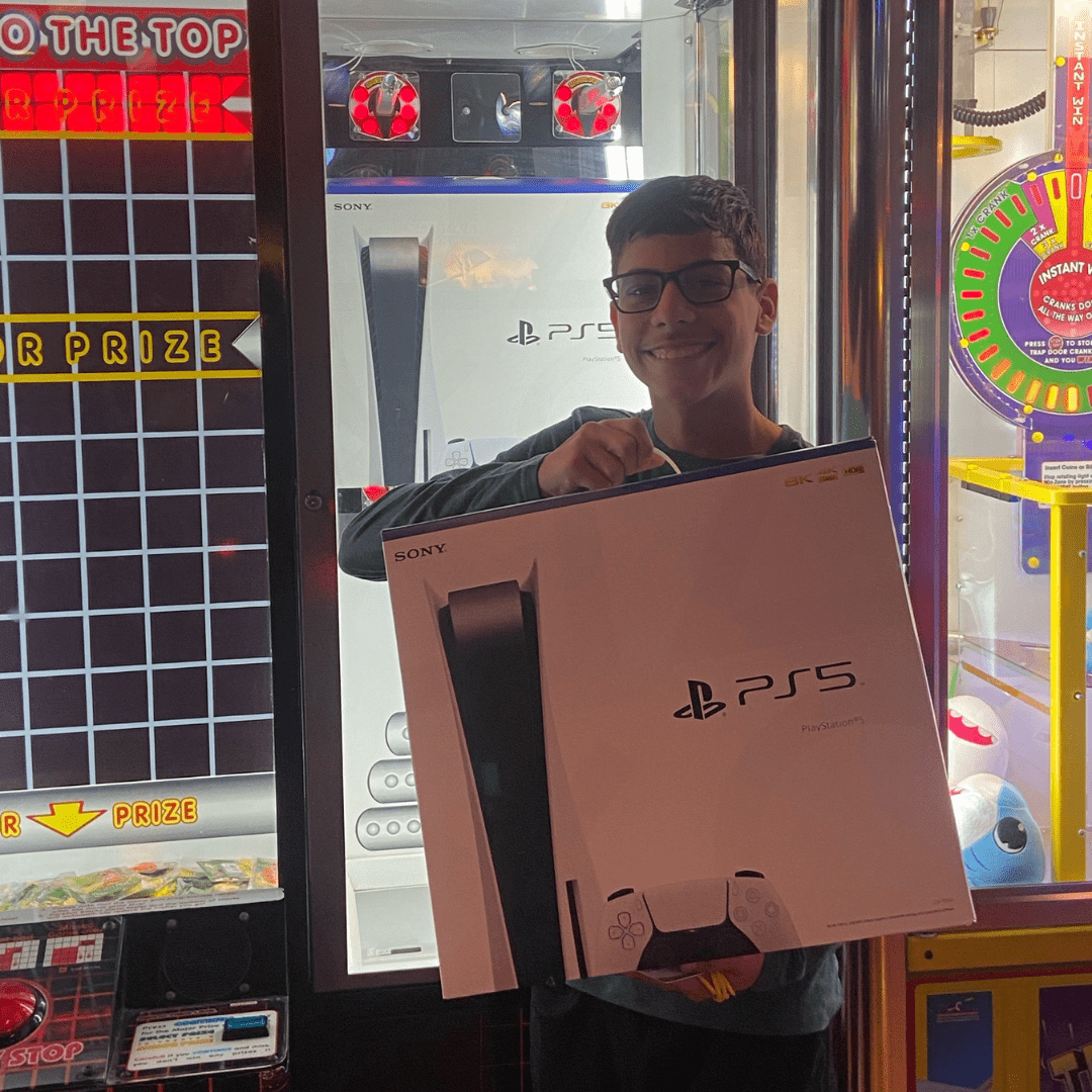 This person won a PlayStation 5 in the Stacker Machine, part of our Arcade at SHenaniganz of Rockwall!
